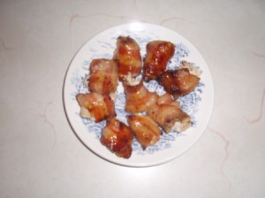 Golden chicken bites on a plate.