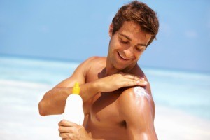 Man Applying Sunscreen to Himself