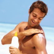 Man Applying Sunscreen to Himself