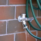 A frozen outdoor water faucet.