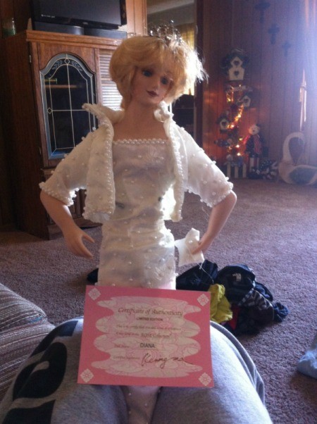 Diana doll wearing a white dress.