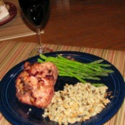 glazed chicken with asparagus and rice on plate.