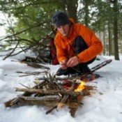 Man Building Fire in the Forest