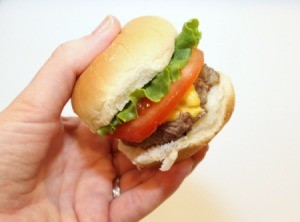 mini burger in hand
