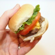 mini burger in hand