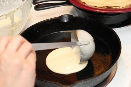 Making Crepes - Adding batter to hot pan.