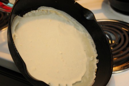 Making Crepes - Swirling batter around pan.