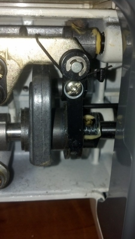 View of underside of machine where lever is.