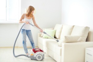 Woman Using Vacuum Cleaner