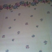 Small pink and blue flower print wallpaper.