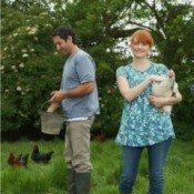 Couple Caring for Their Chickens