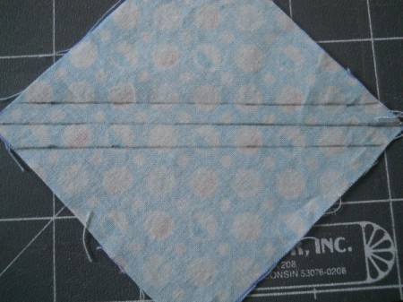 Square marked with dividing line and both seam lines.