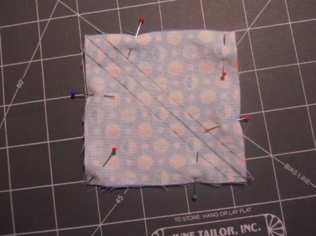 Pinning squares together.