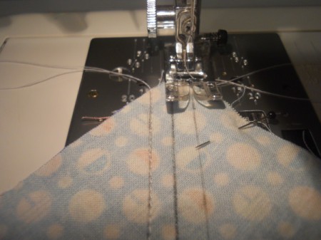 Sewing along one seam line.