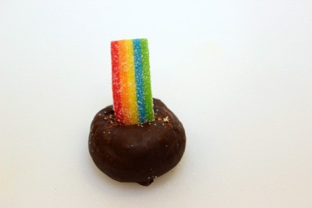 insert rainbow candy into doughnut