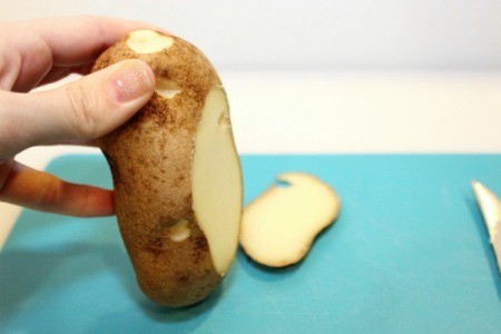 slice off bottom of potato