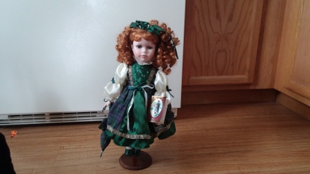 Geppeddo Doll in green outfit.
