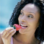 Woman Eating Strawberries