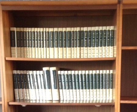 Volumes on bookshelf.
