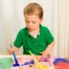 Child Painting at Play Table