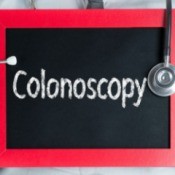 Doctor Holding Colonoscopy Sign