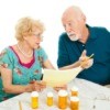 Elderly Couple Paying Medical Bills