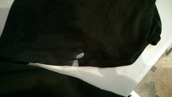 White paint on black clothing.