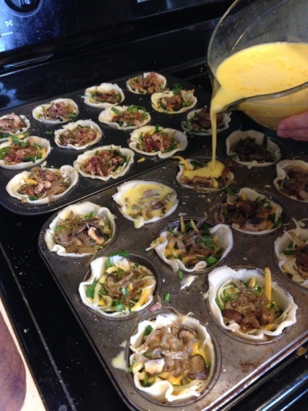 Add egg milk mixture to quiches