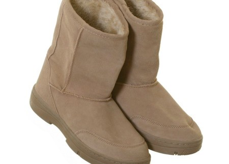 A pair of tan suede boots.