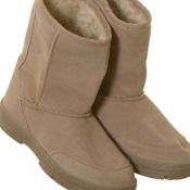 A pair of tan suede boots.