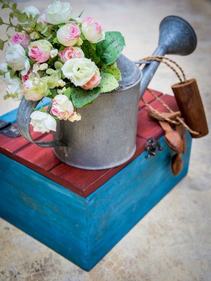 Artificial Flowers in the Garden Watering Can