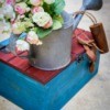 Artificial Flowers in the Garden Watering Can