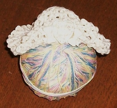 Ball of yarn and crochet work.