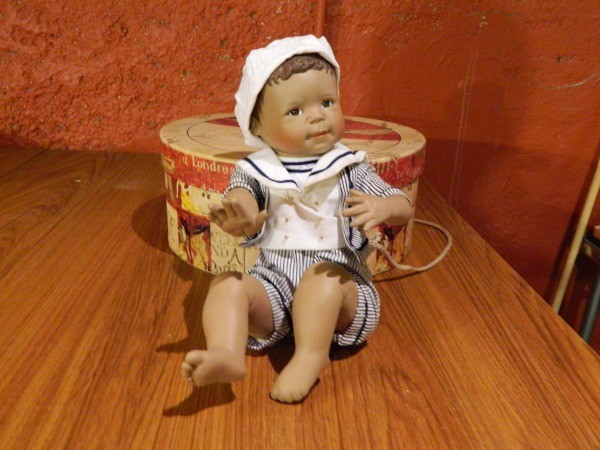 Boy doll with striped sailer style shirt.