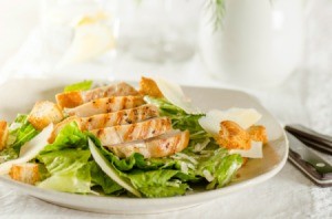 A healthy salad with chicken breast.