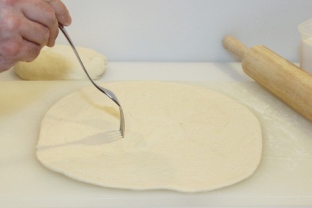 poke holes in pizza dough