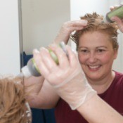 A woman dyeing her hair.