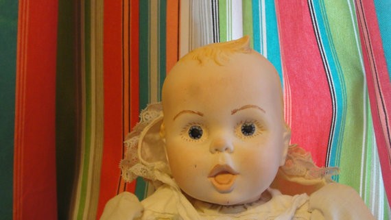 Baby doll with bonnet off.