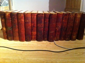 Old encyclopedias with red binding.