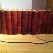 Old encyclopedias with red binding.