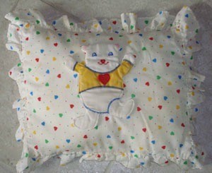 baby pillow with bear motif