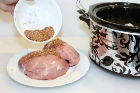 rub spices onto pork