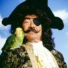 Man Dressed as Pirate with Parrot on Shoulder