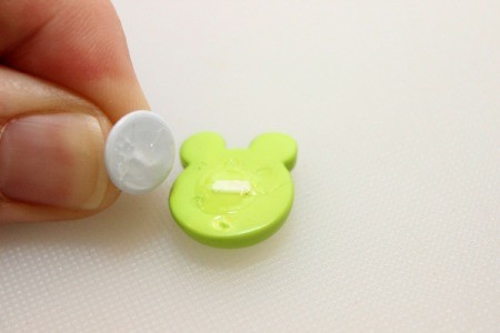 apply glue to pin and button