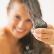 Woman showing clean hair.