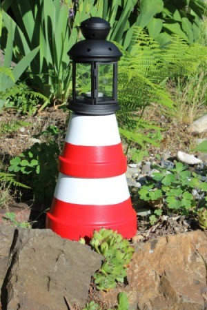 clay pot lighthouse in garden