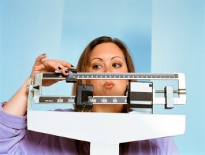 Woman Weighing Herself