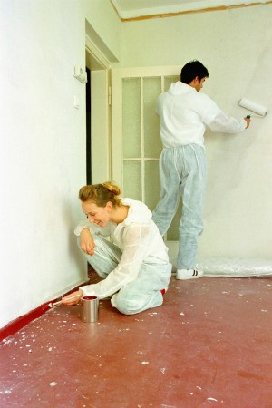 Couple Painting a Room Quickly
