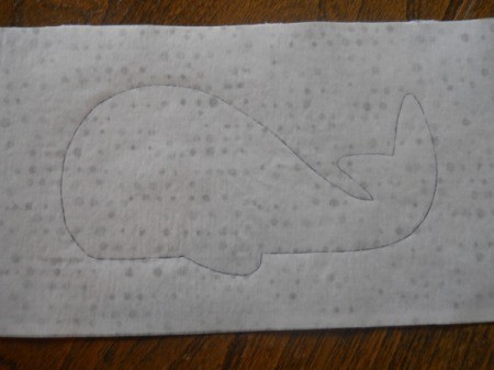 view of whale traced onto paper backing