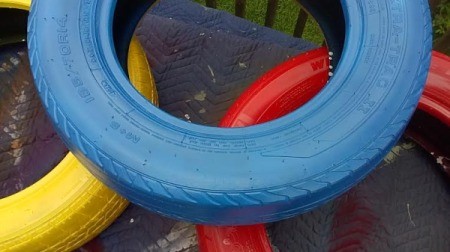 blue, red, and yellow stacked tires